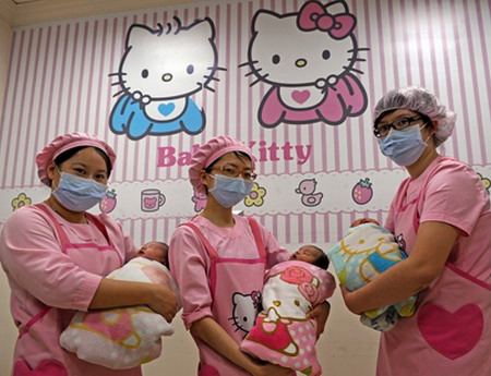 Nursing staff pose with new-born babies in front of Hello Kitty decorations at Hau Sheng hospital in Yuanlin, in Changhua county, central Taiwan, on January 14, 2009. More then 2,000 babies have been born at this 30-bed hospital, decorated with the Japanese animated character Hello Kitty, over the past two years. AFP PHOTO / Sam YEH (Photo credit should read SAM YEH/AFP/Getty Images)
